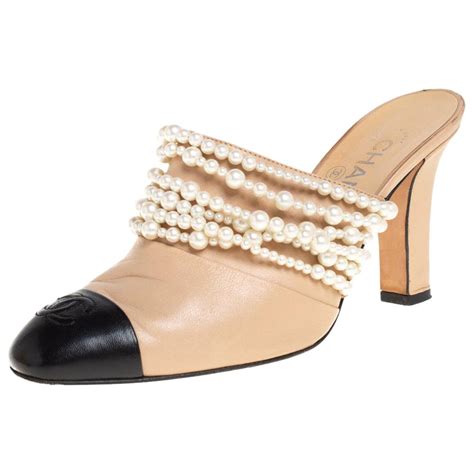 chanel beige mules with pearl serpent